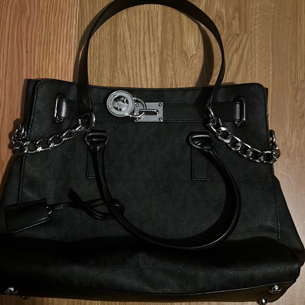 Black Michael Kors purse with the matching purse used once